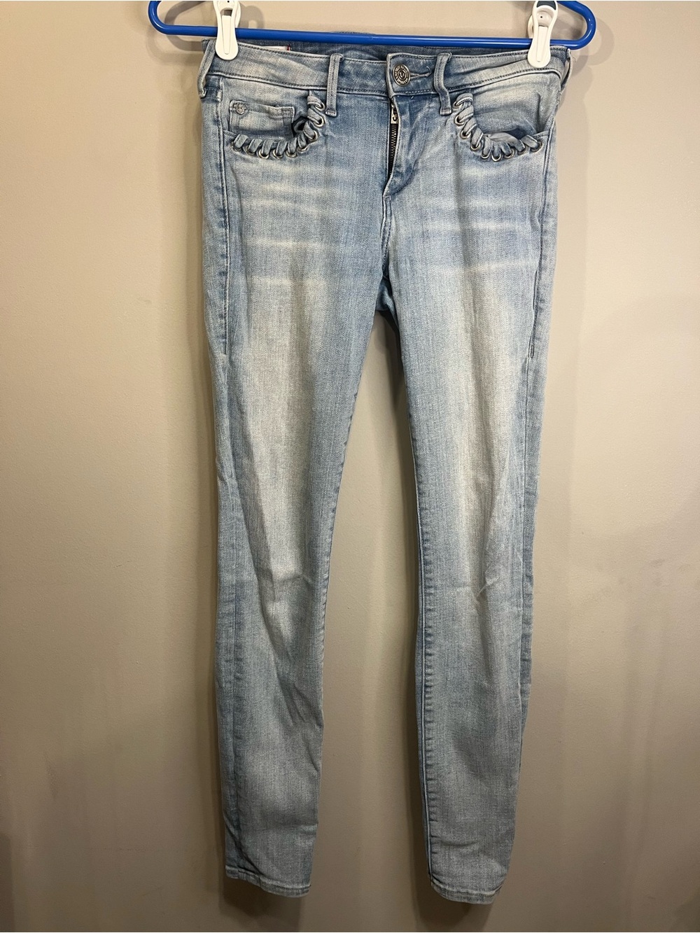 True Religion Light Blue Skinny Jeans with Ruffle Pocket Trim
